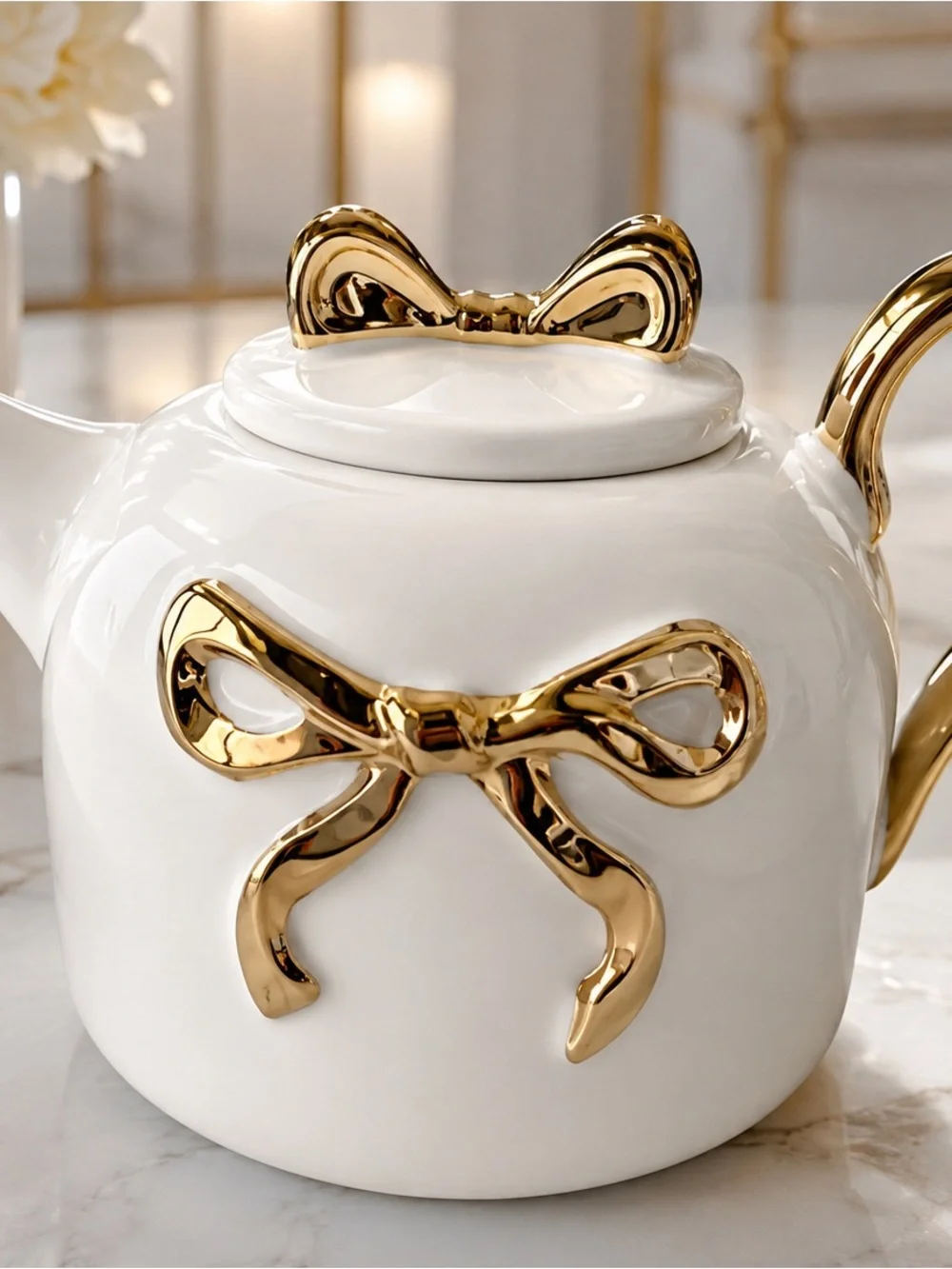 White Ceramic Teapot with Gold Bow Accents